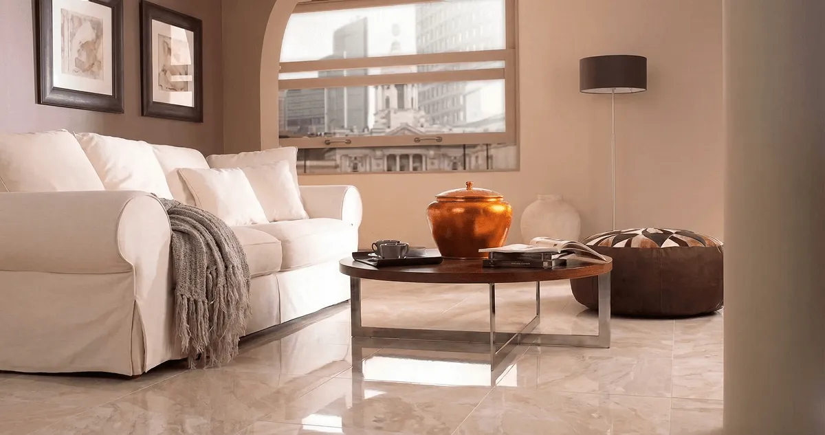 Modern living room with professionally installed marble flooring, a beige sofa, coffee table in Kansas City, MO